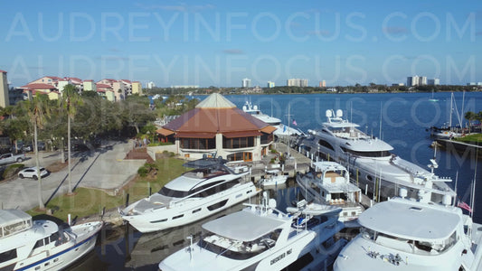 Luxury Yachts at Waterfront Marina / Restaurant